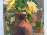 Yellow roses in terracotta jug